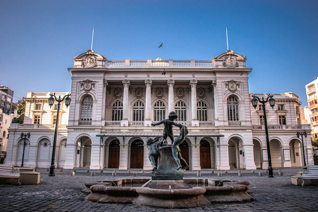 Elegant view of the historic Municipal Theatre in Santiago, Chile with a central fountain.